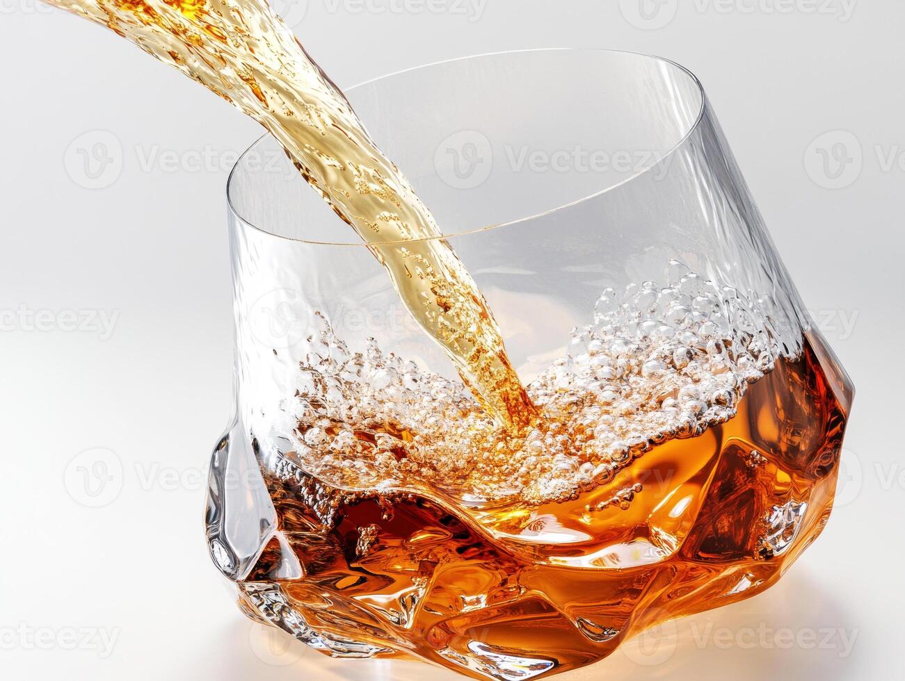 Whiskey pouring into a textured glass with bubbles photo