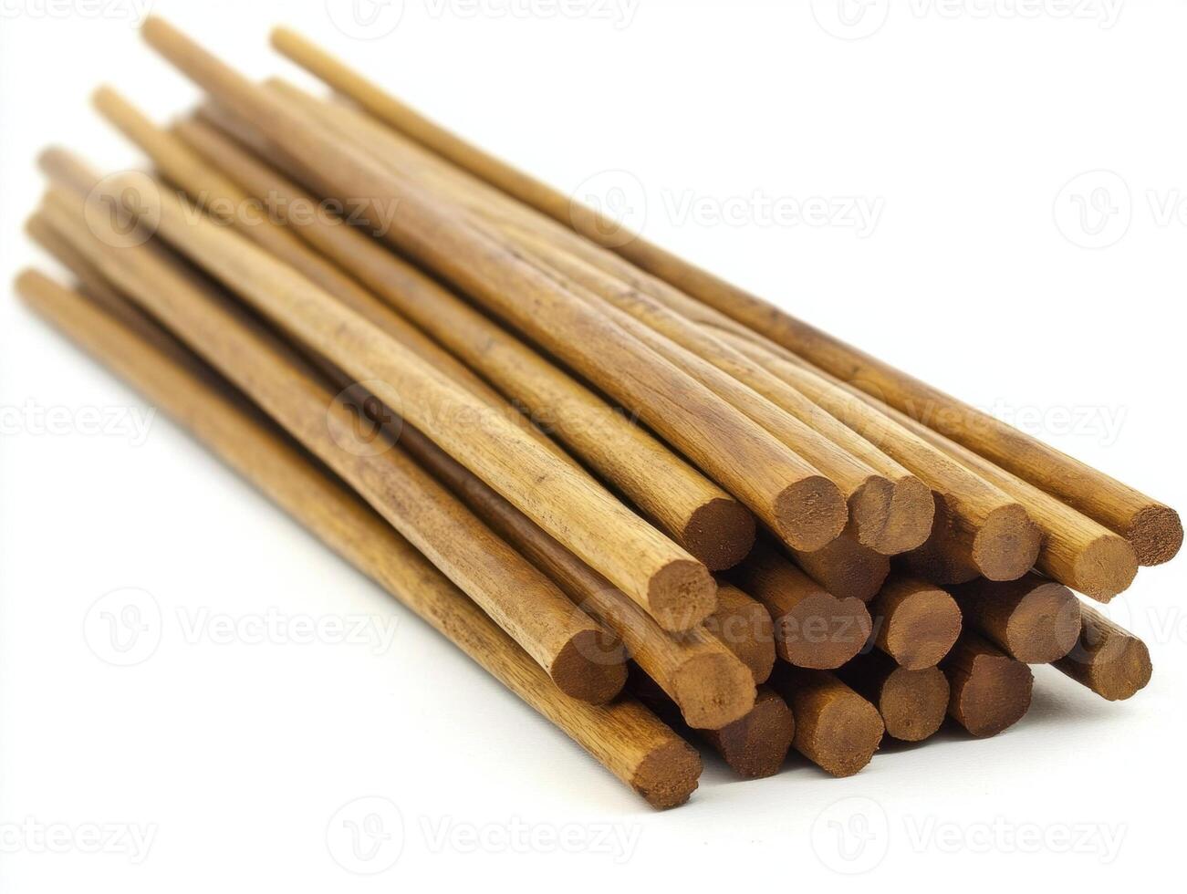 Stacked wooden sticks arranged neatly for crafting and projects photo