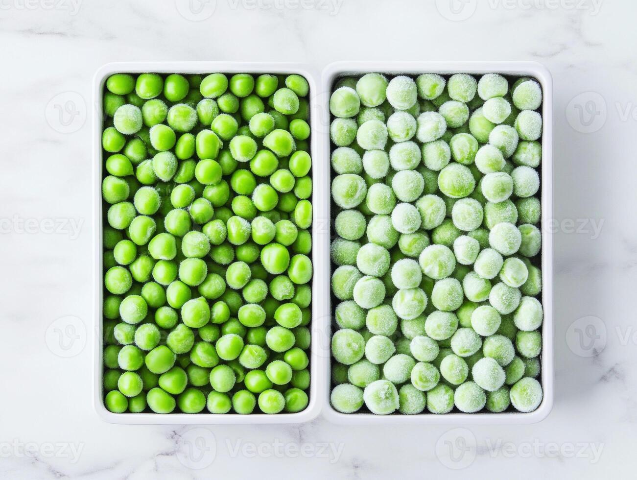 Fresh and frozen green peas in contrasting trays on a marble surface photo