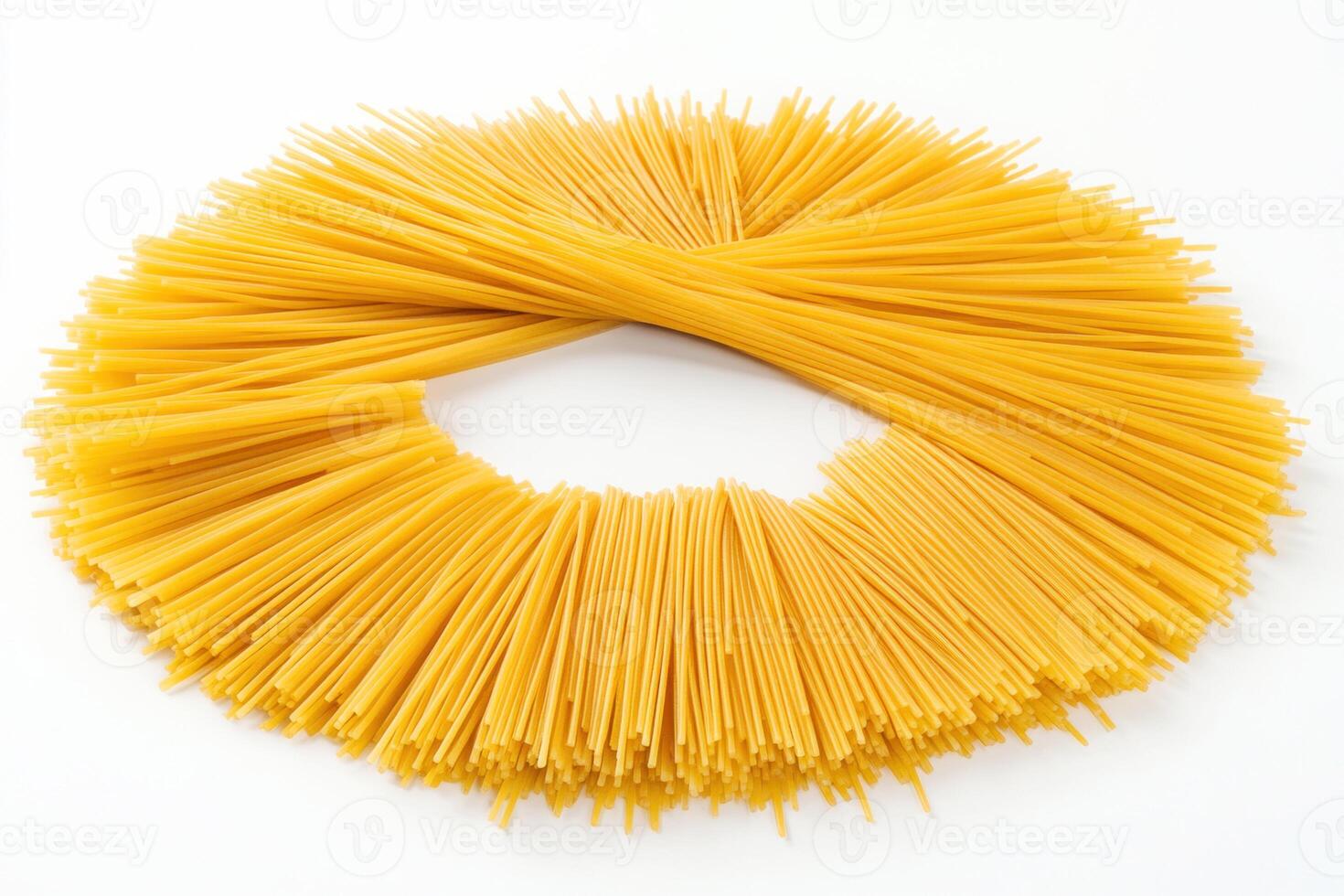 Spaghetti arranged in a circular shape on a white background photo