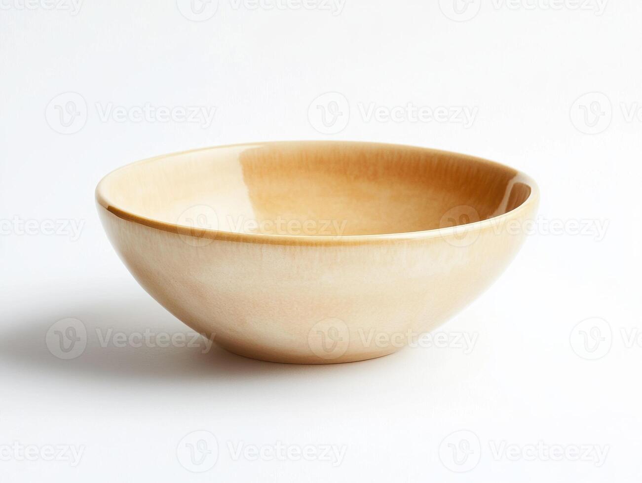 Ceramic bowl with smooth finish placed on a light background photo