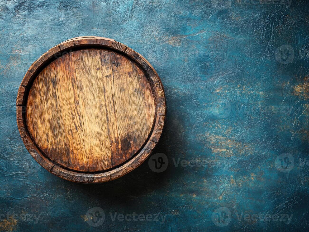 Wooden round tray on textured blue surface in a rustic setting photo