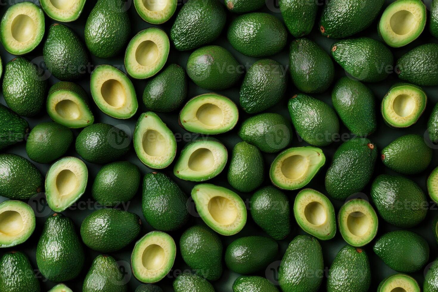 Fresh avocados arranged neatly on a dark surface in a vibrant display photo