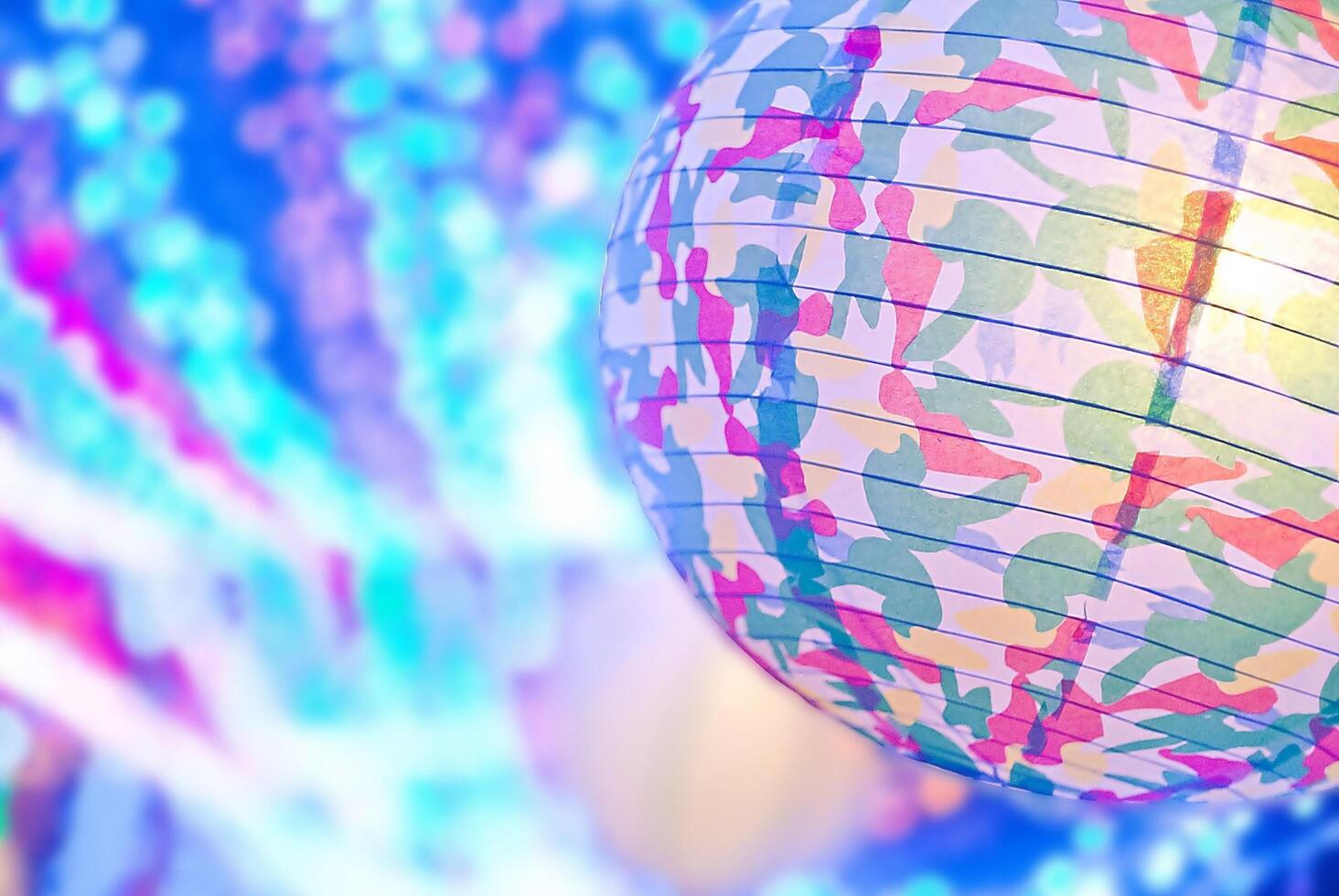 paper lamp shade on bokeh muticlor background. photo