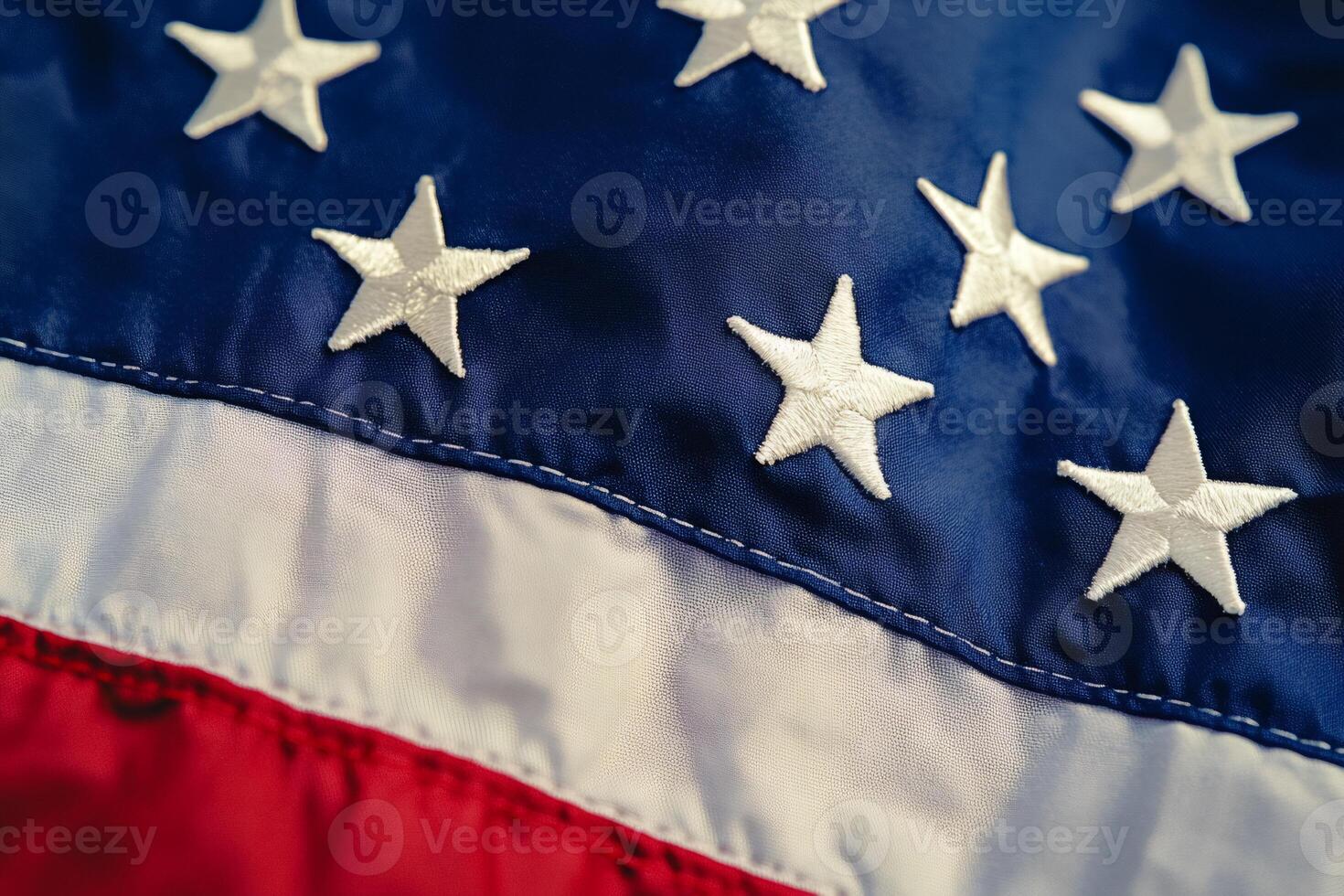Close up of american flag showing embroidered stars and stripes photo