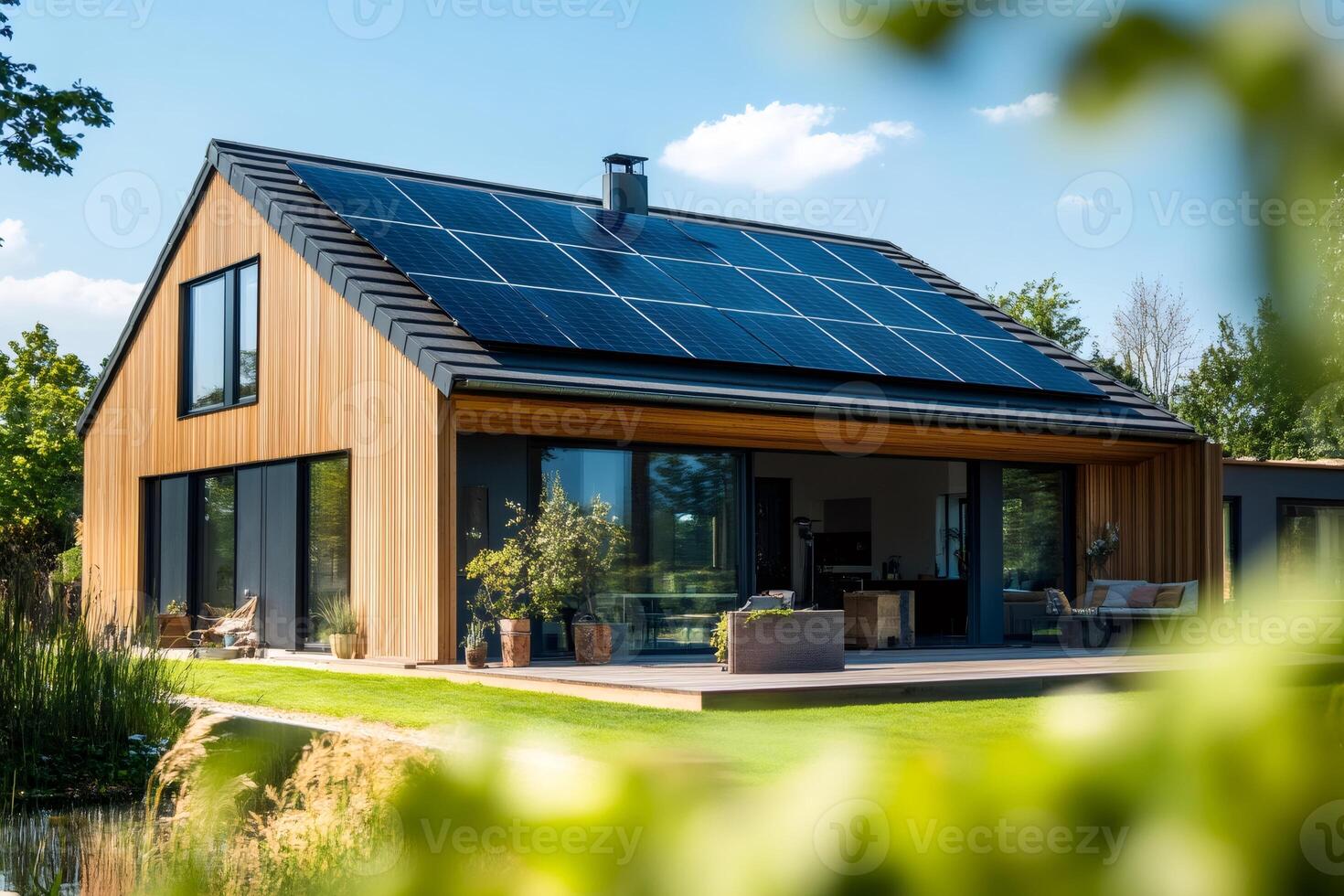 Modern wooden house generating clean energy with solar panels on roof photo