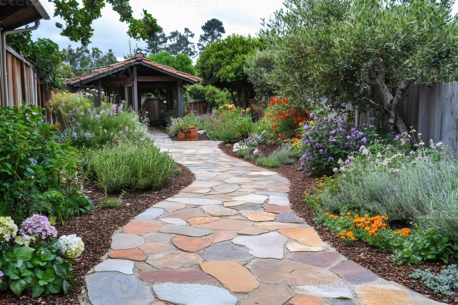 Winding flagstone path leading to covered patio in lush garden photo
