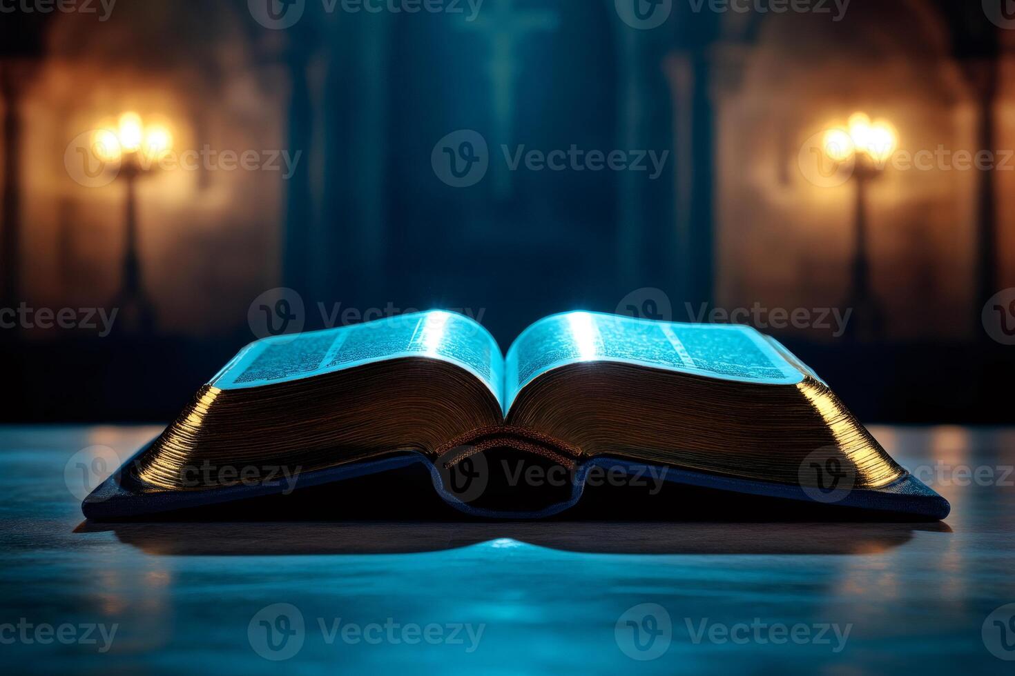 Open bible glowing in church with cross and candles in background photo