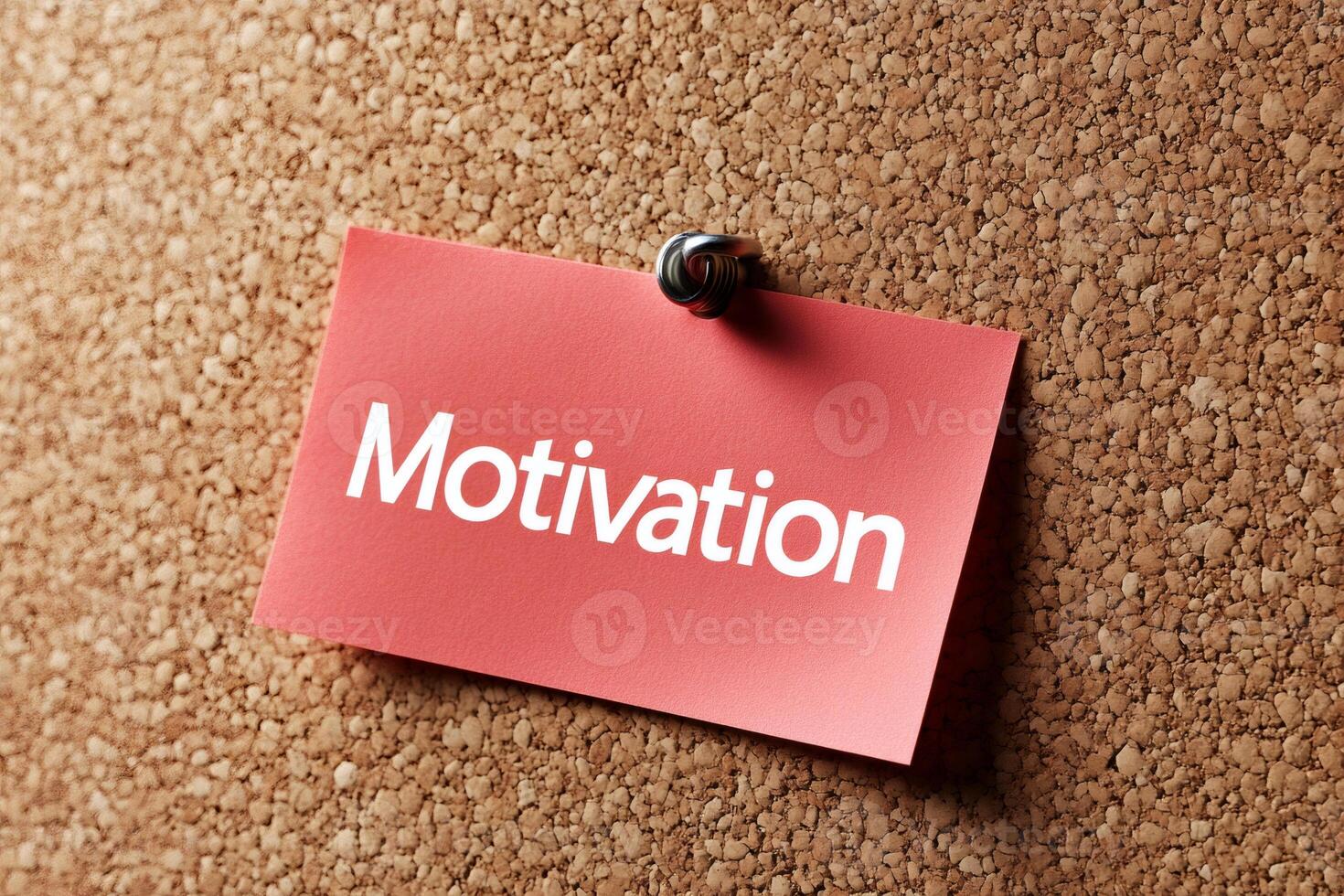 Red sticky note on cork board showing motivation photo