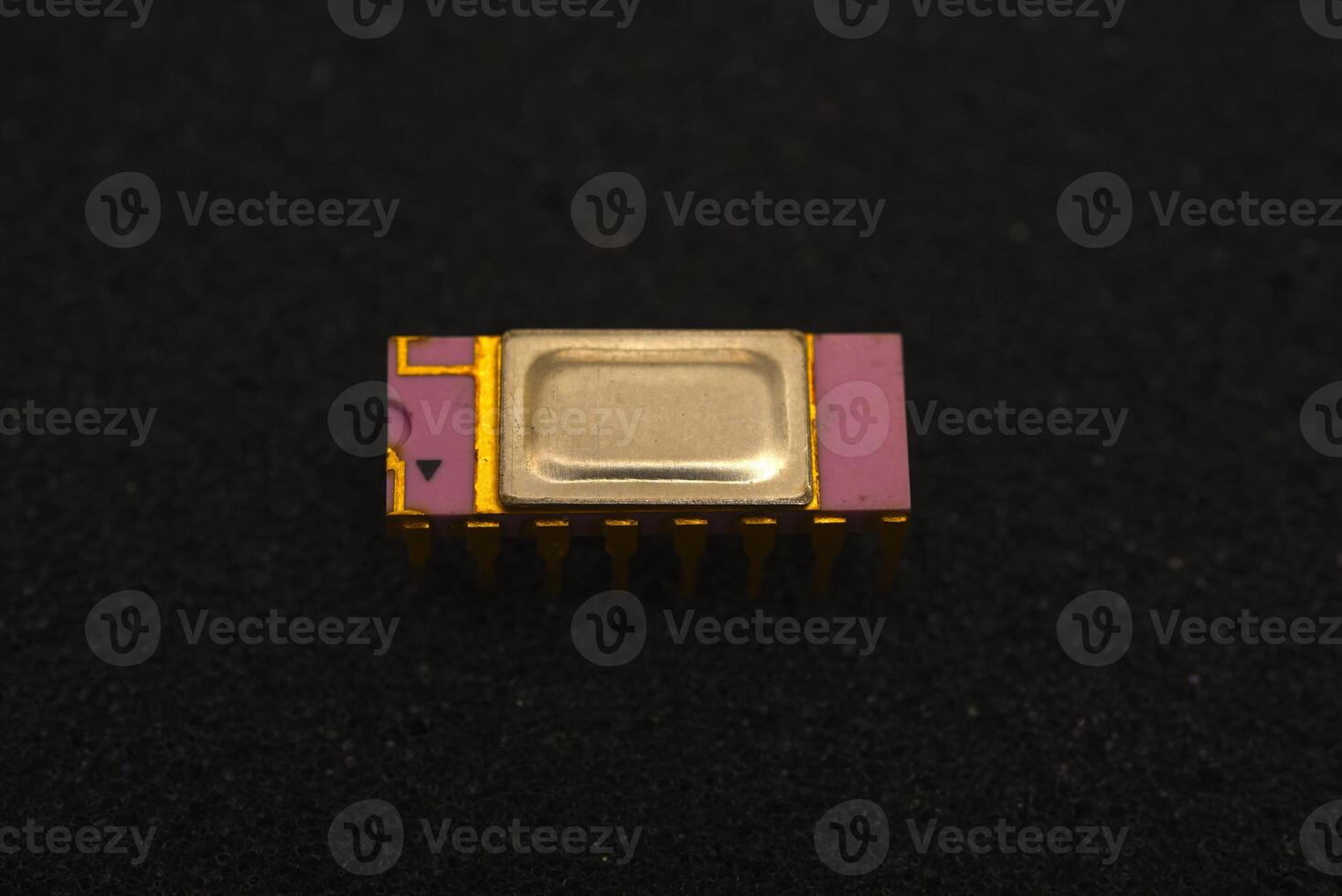 Aging microelectronics on protective foam. The microcircuit is on black foam. An integrated circuit for radio electronics. photo