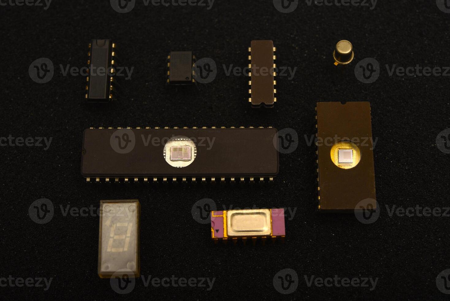 Retro integrated circuits for electronic components.Several microchips on black foam. Old integrated circuits for radio electronics. photo