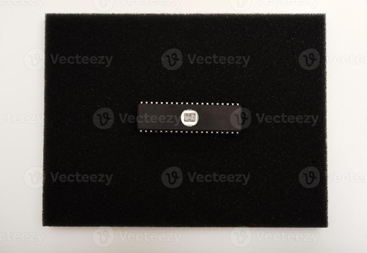 Classic chipset arrangement for electronics. The microcircuit is on black foam. An integrated circuit for radio electronics. photo