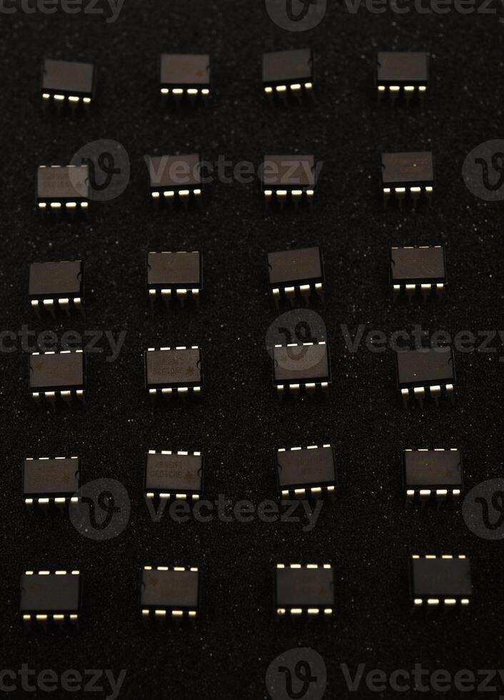 Electronic dies on onyx base. Grouped nodes on a foundation. photo