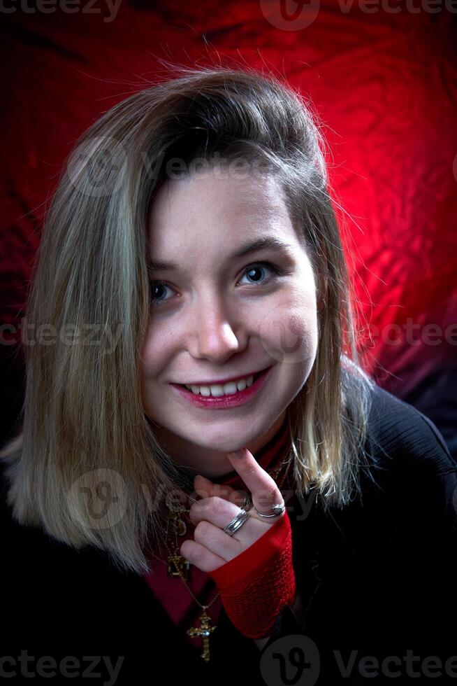 A woman with a red scarf on her head photo