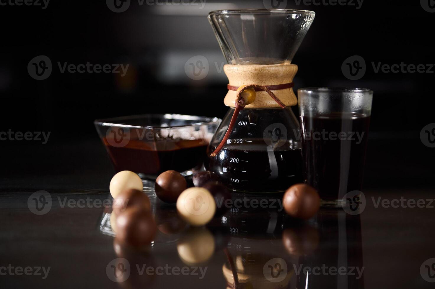 Coffee and Chocolate Treats Displayed on a Dark Elegant Surface photo