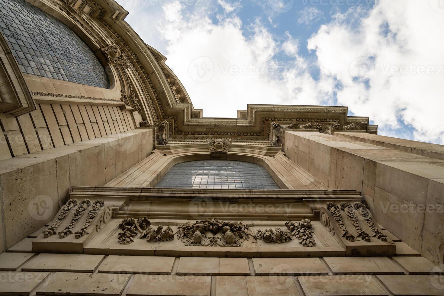 An angled perspective of St. Paul s Cathedral hig hlig hts its sculpted facade and elegant curved stonework. photo