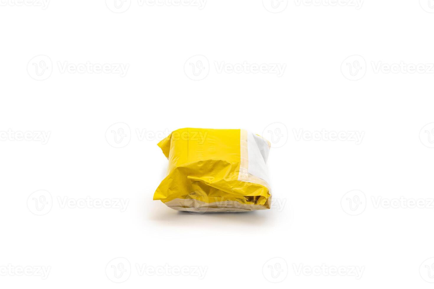 Isolated Yellow Postal Package from shopping online, is delivered to the buyer. It's shot in the studio light in front of white background1 photo