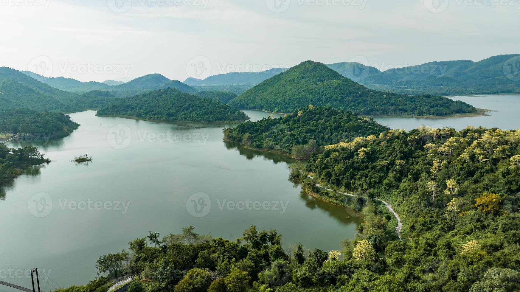 Kaeng Krachan dam with lake view and many green moutain, blue sky background. Kaeng Krachan Dam national park, Phetchaburi province, Thailand in aerial view from drone.1 photo