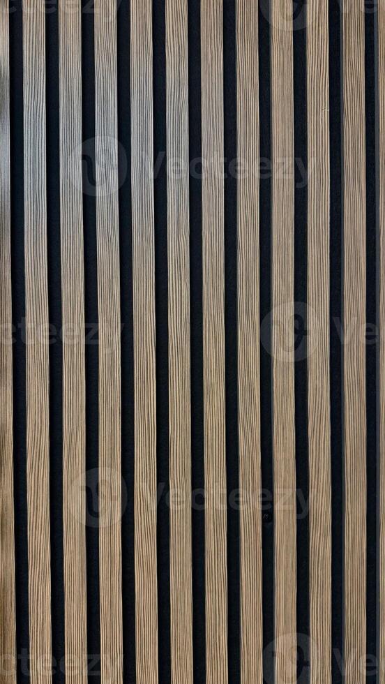 Modern Wooden Panel with Vertical Striped Design for Contemporary Interiors. Close-up view of wooden panel featuring vertical striped patterns in modern design, perfect for interior design concepts photo