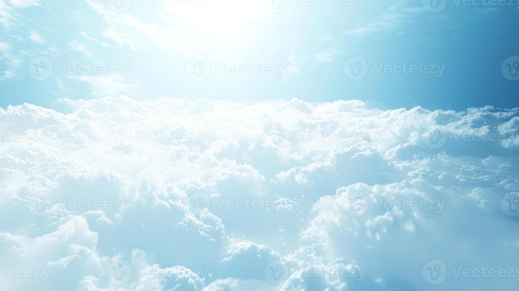 serene view of fluffy white clouds under bright blue sky, illuminated by soft sunlight, creating peaceful and dreamy atmosphere photo