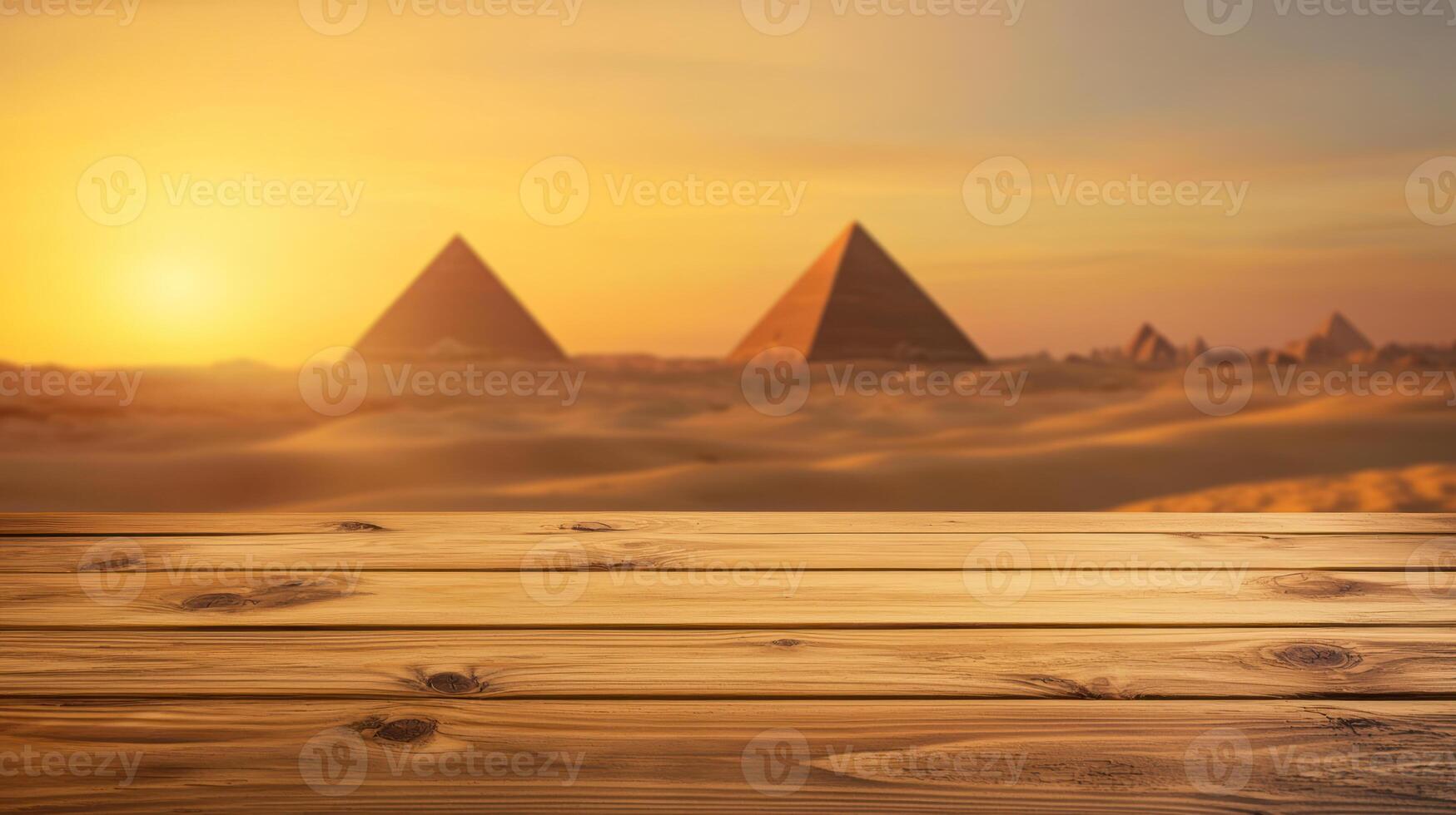 Empty wooden tabletop with blurred desert landscape featuring ancient pyramids at golden hour, evoking warmth and history photo