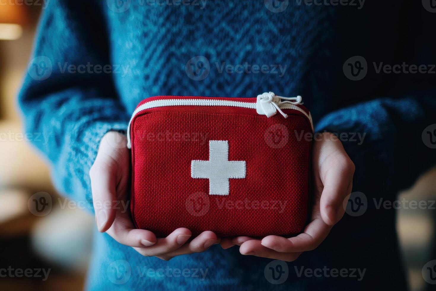 woman Holding Bright Red First Aid Kit with White Cross Symbol for Emergency Medical Care and Safety. photo