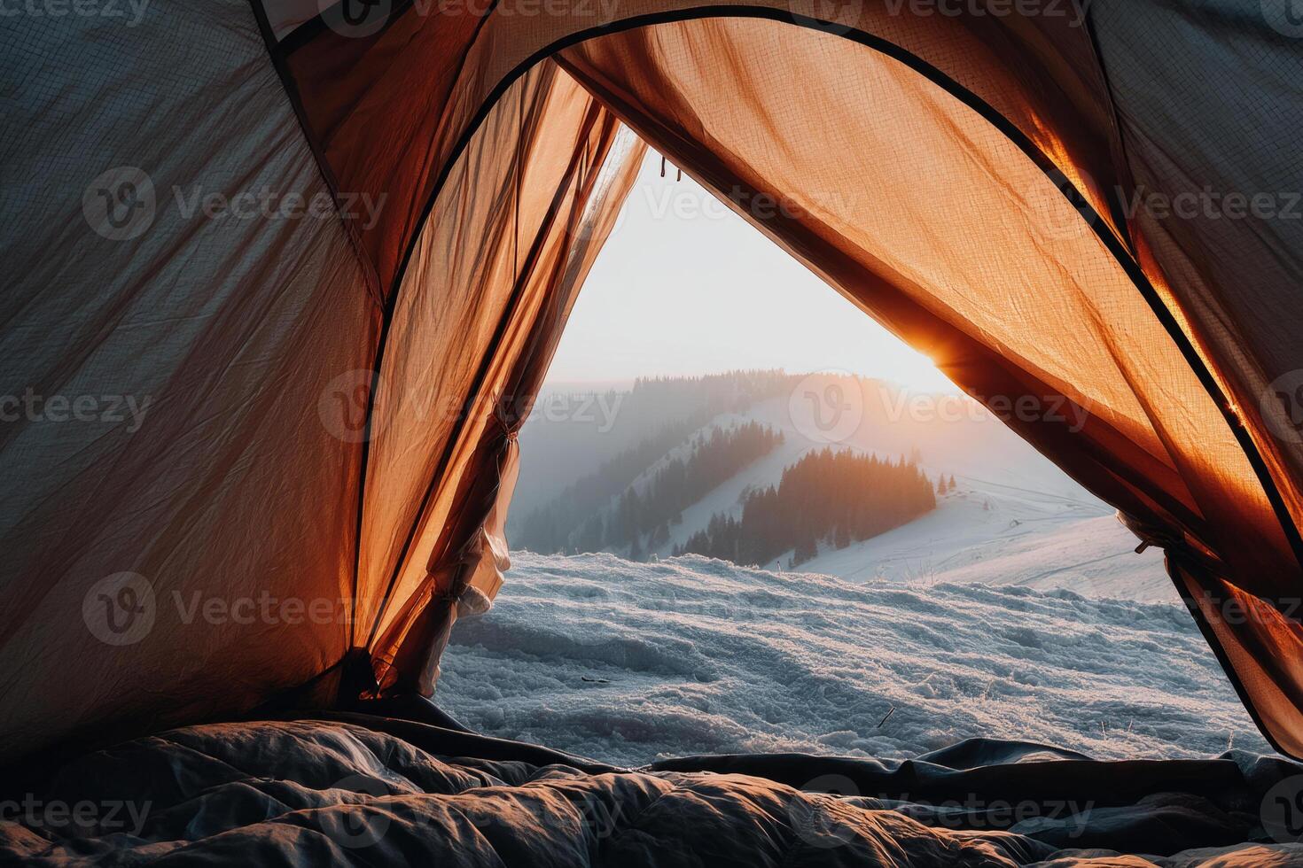 Sunrise view from tent in snowy mountains photo