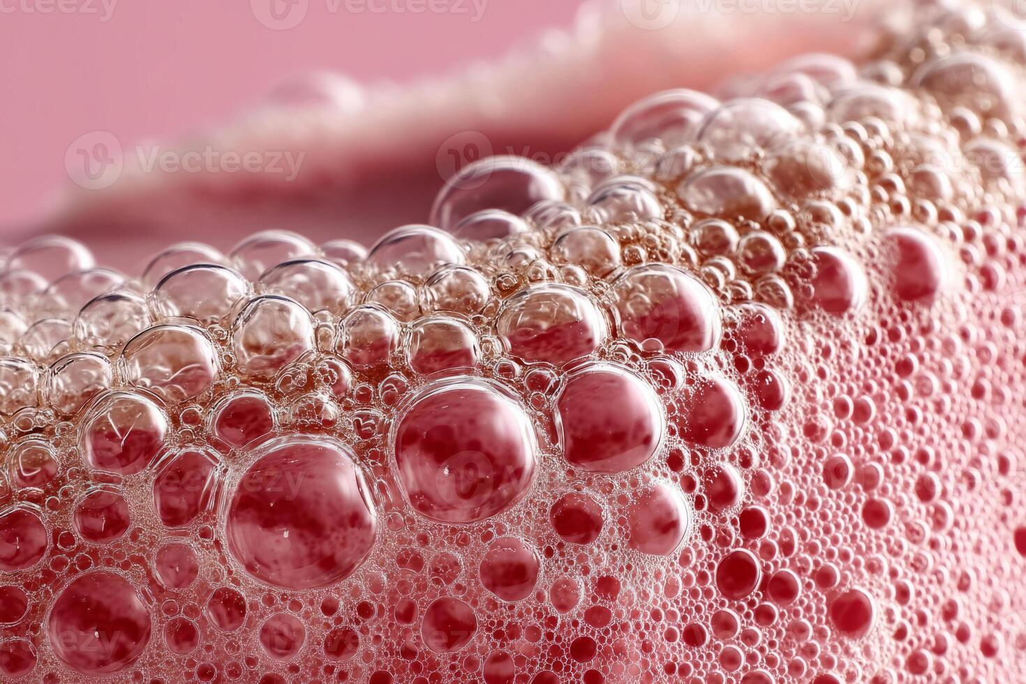 Pink foam texture with glossy bubbles photo