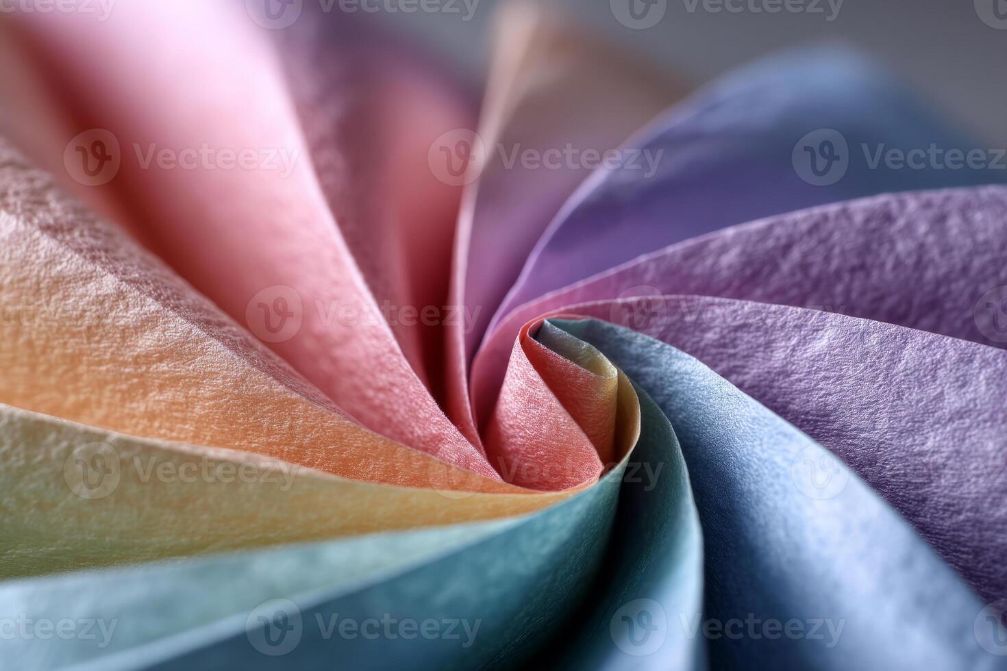 Spiral folded pastel paper in soft textured colors photo