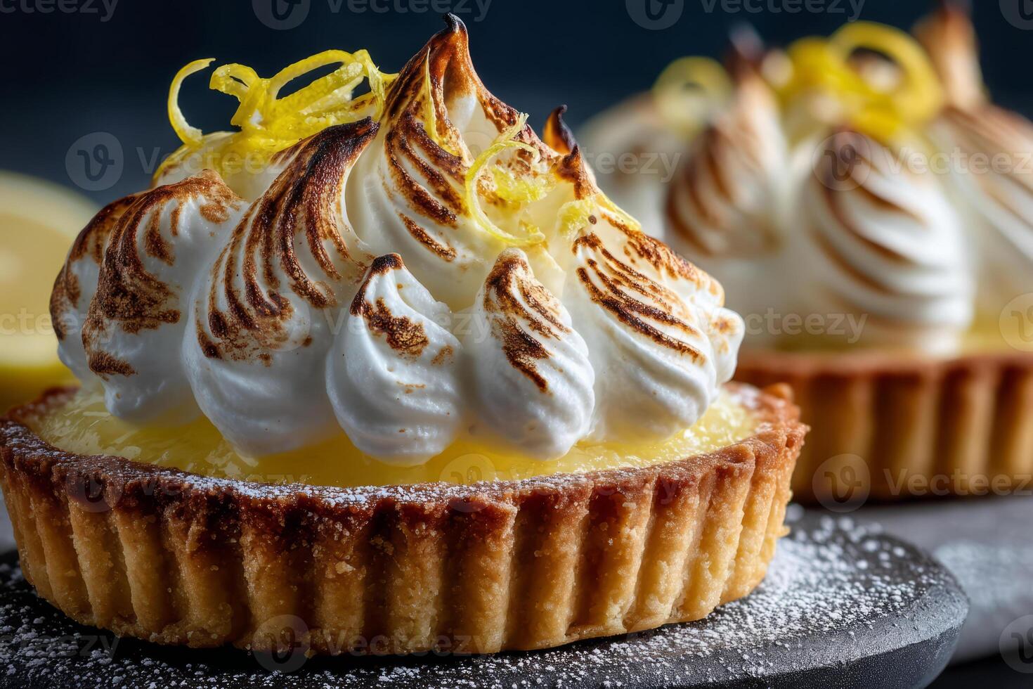 Lemon tart with meringue and citrus zest photo