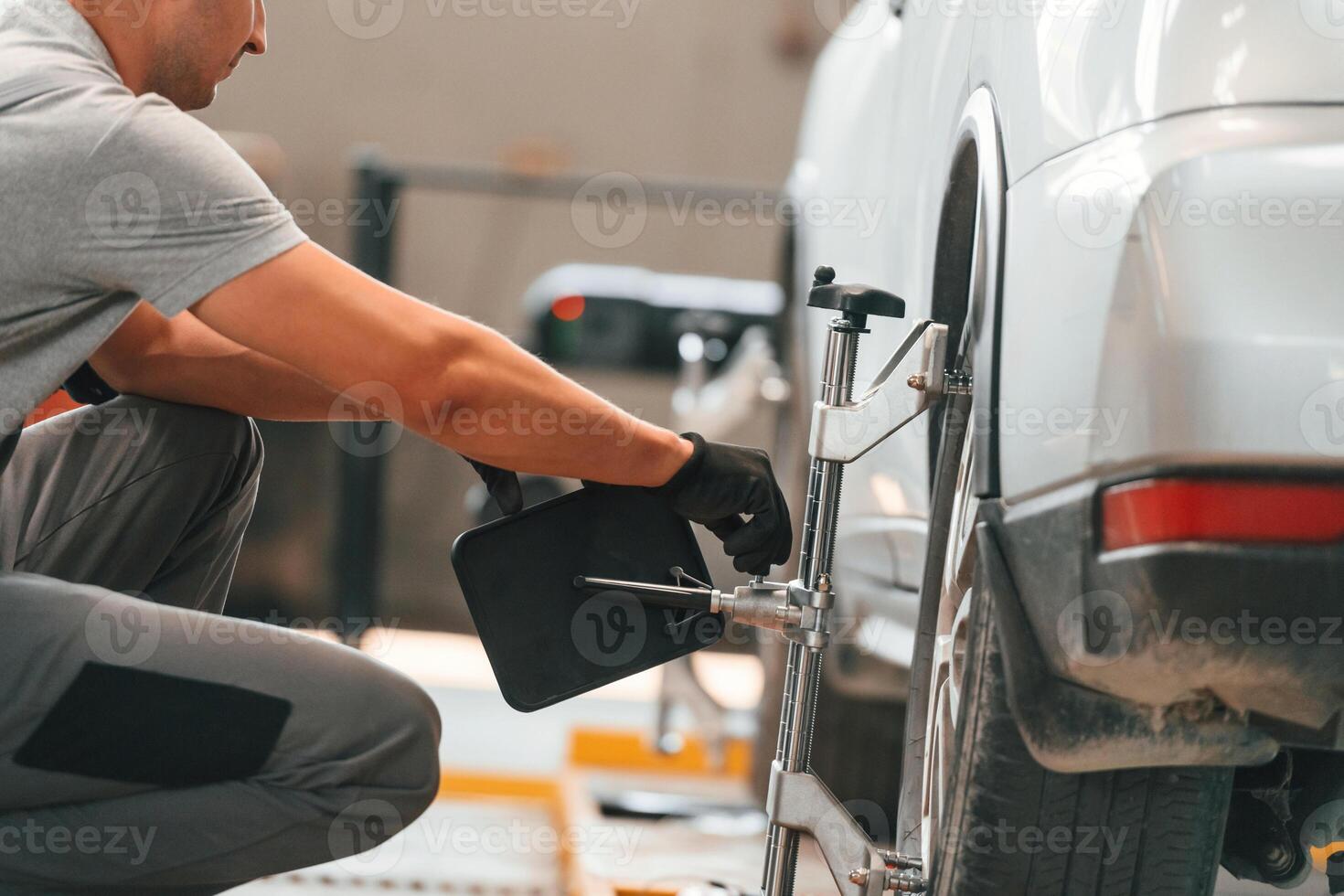 Man is ,works in the automobile repairing salon photo