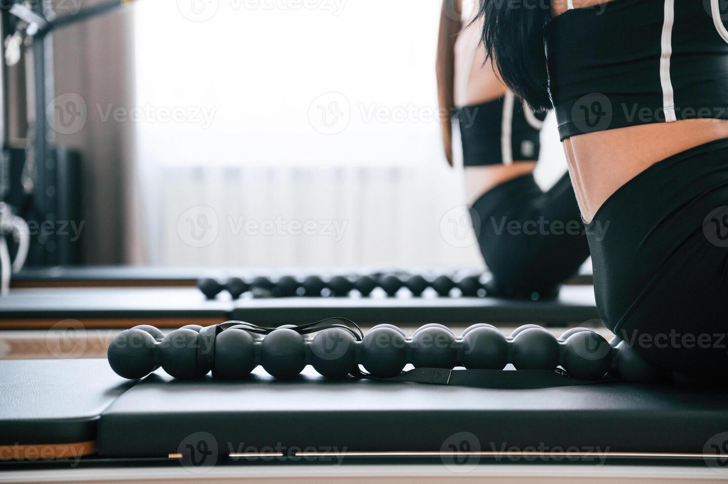 Using device, with, circles for the spine. Women in fitness center are doing exercises photo