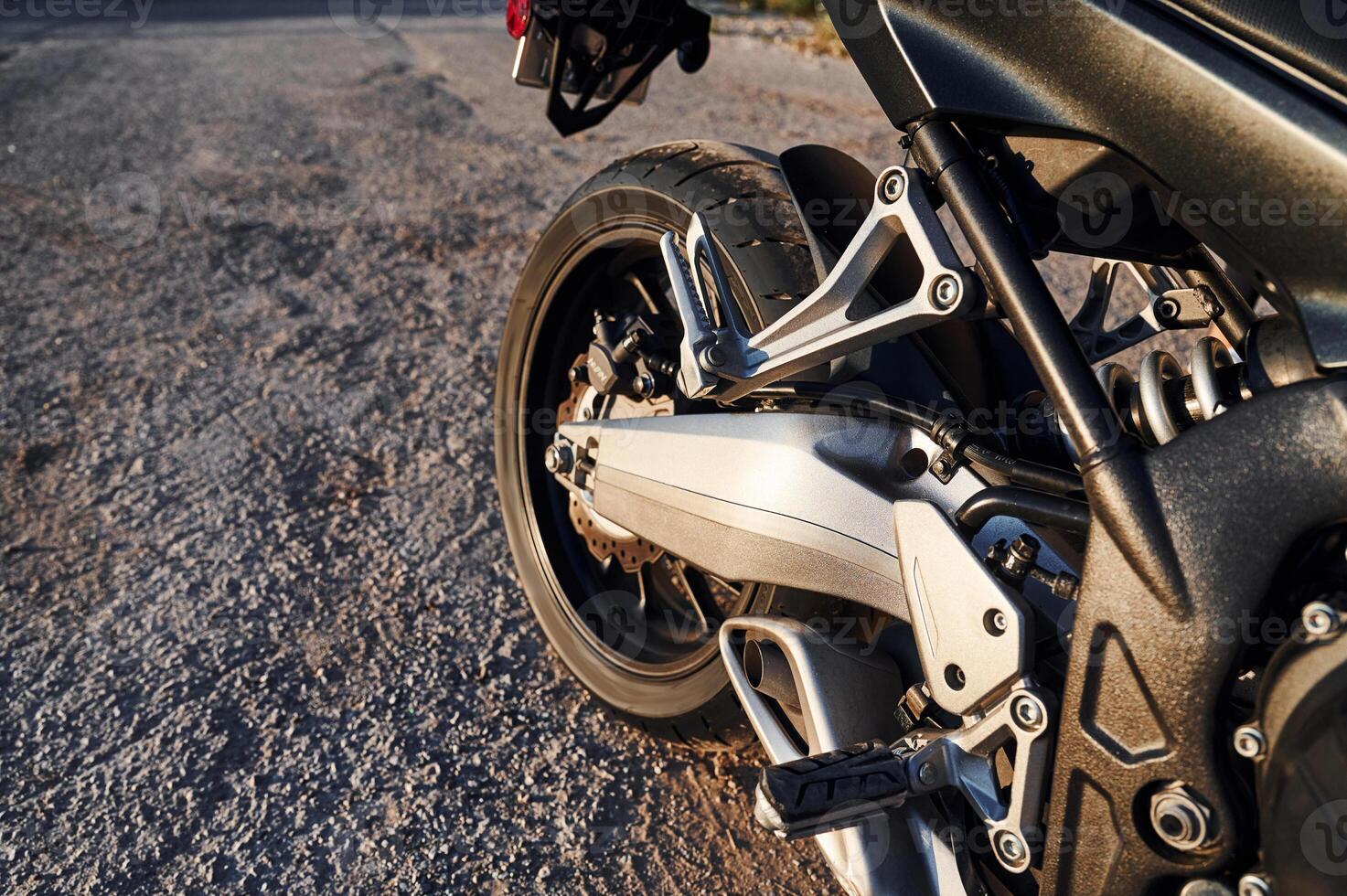 Close, up view ,of ,modern motorcycle that is parked outdoors photo