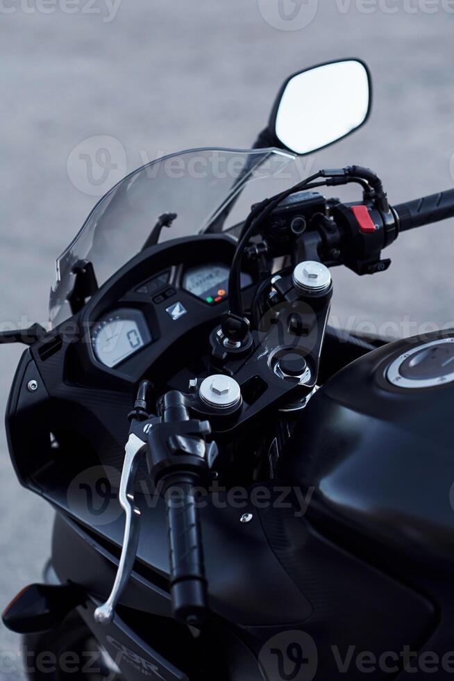 Close up view, of, modern motorcycle that is parked outdoors photo