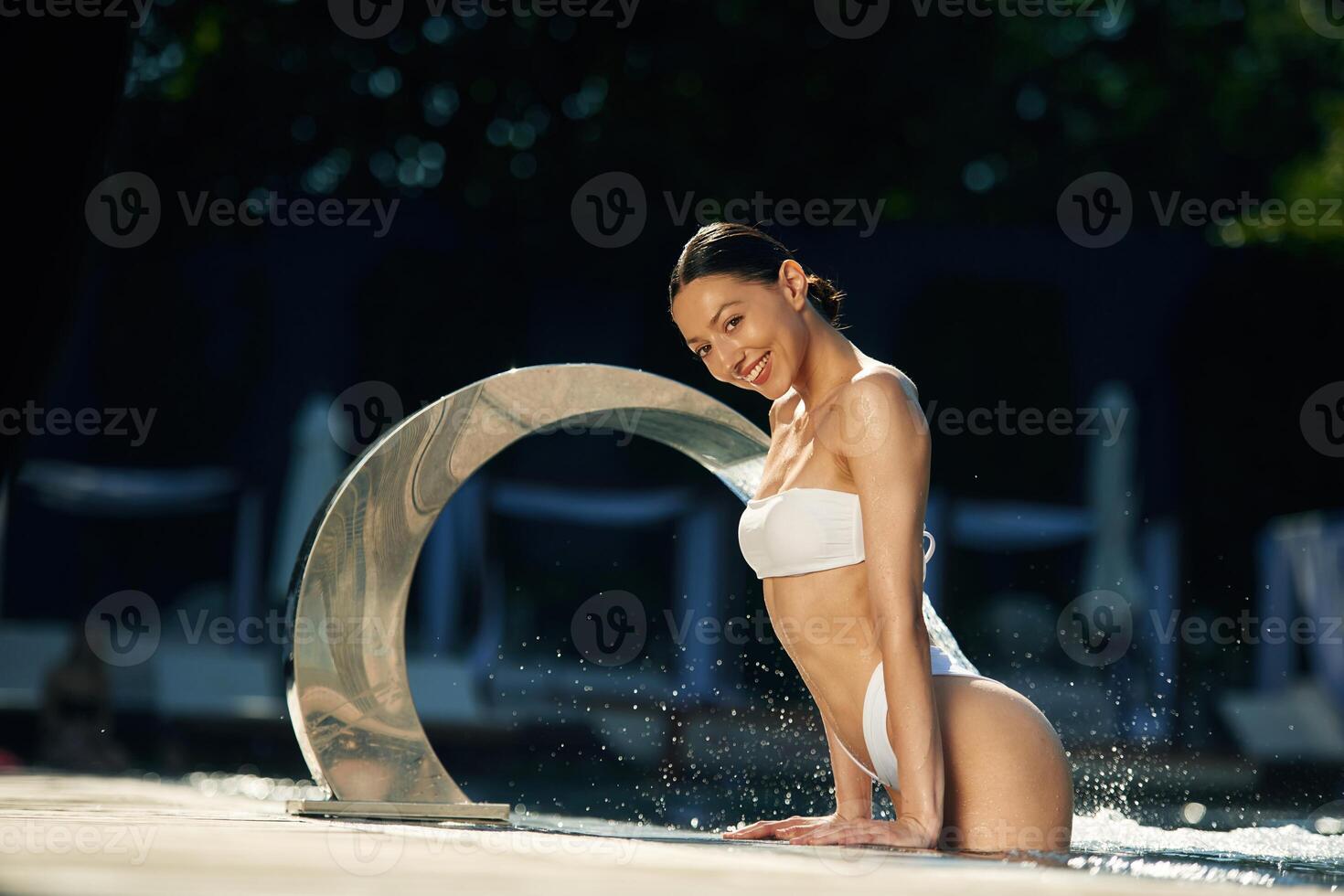 Conception of resort, and relax. Woman in white underwear is in the pool photo