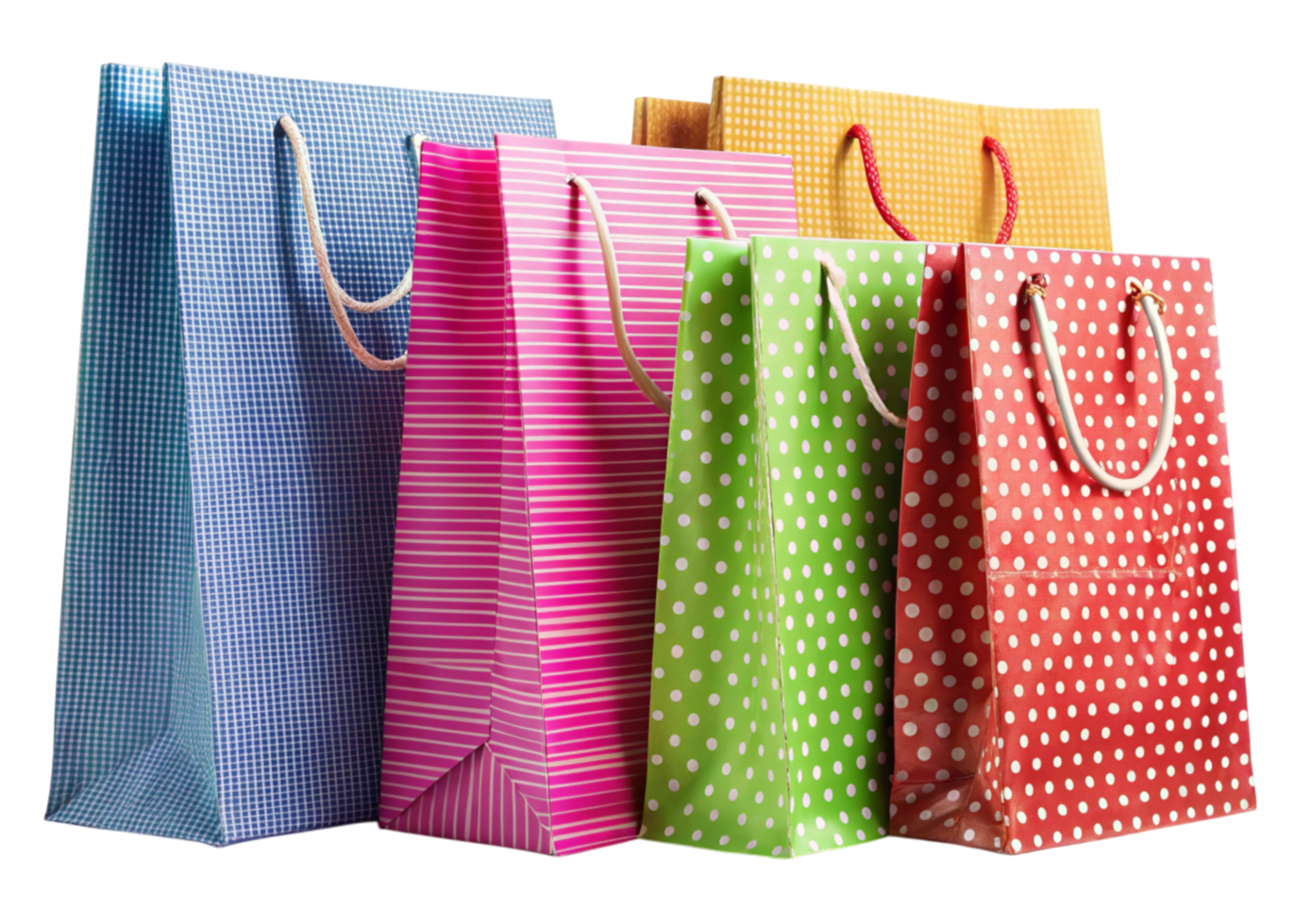 Set of colorful shopping bags with polka dot and striped patterns displayed on a white reflective background png