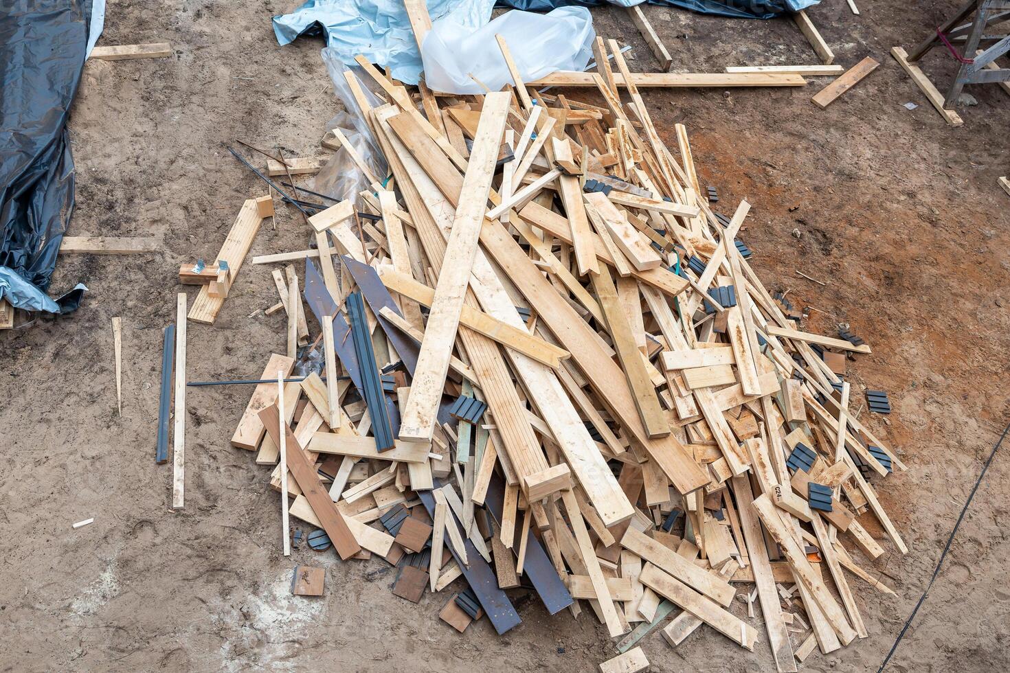 Construction Site with Wooden Planks and Building Materials photo