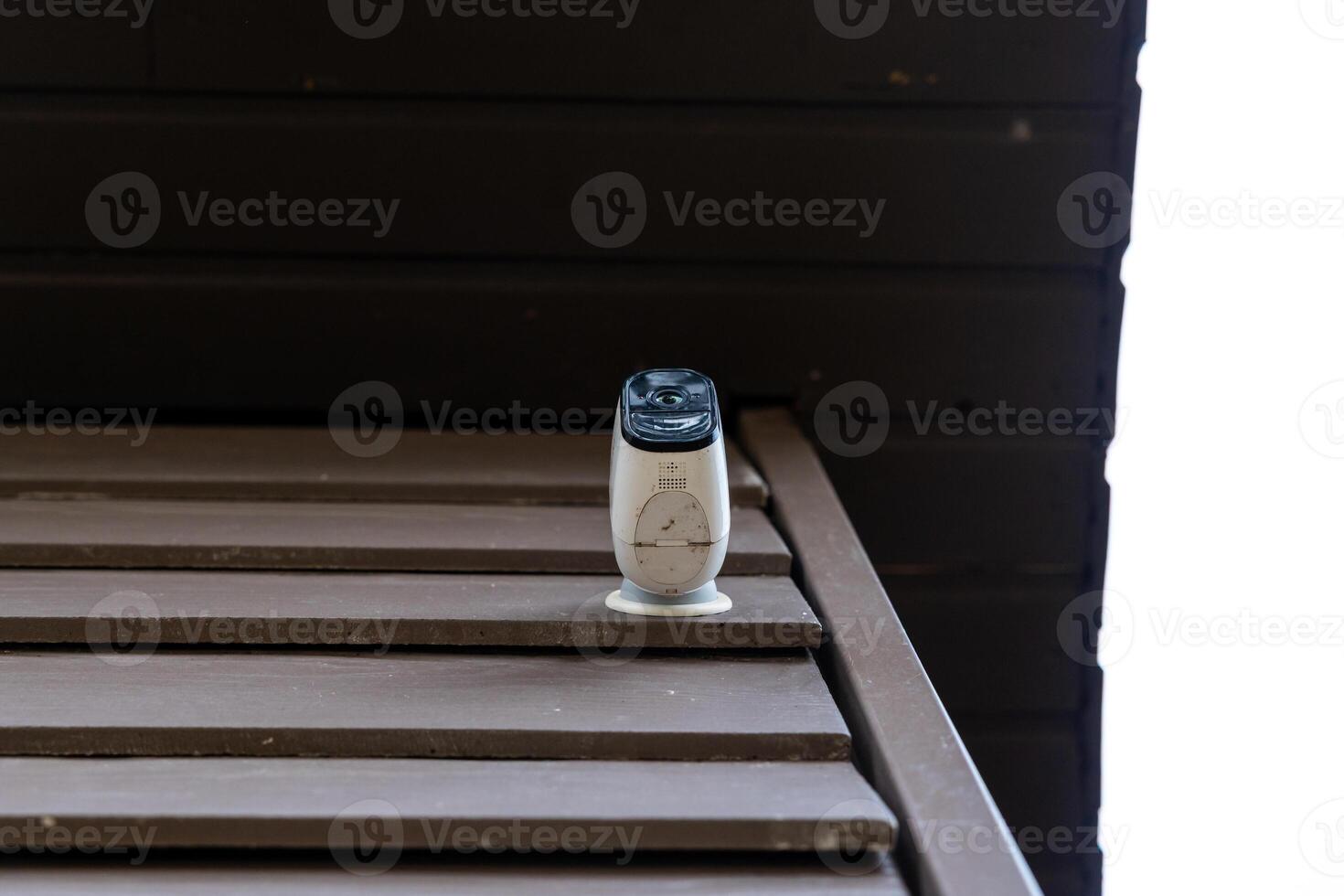 White Wi Fi Router on Wooden Slats with Dark Wooden Wall Background photo