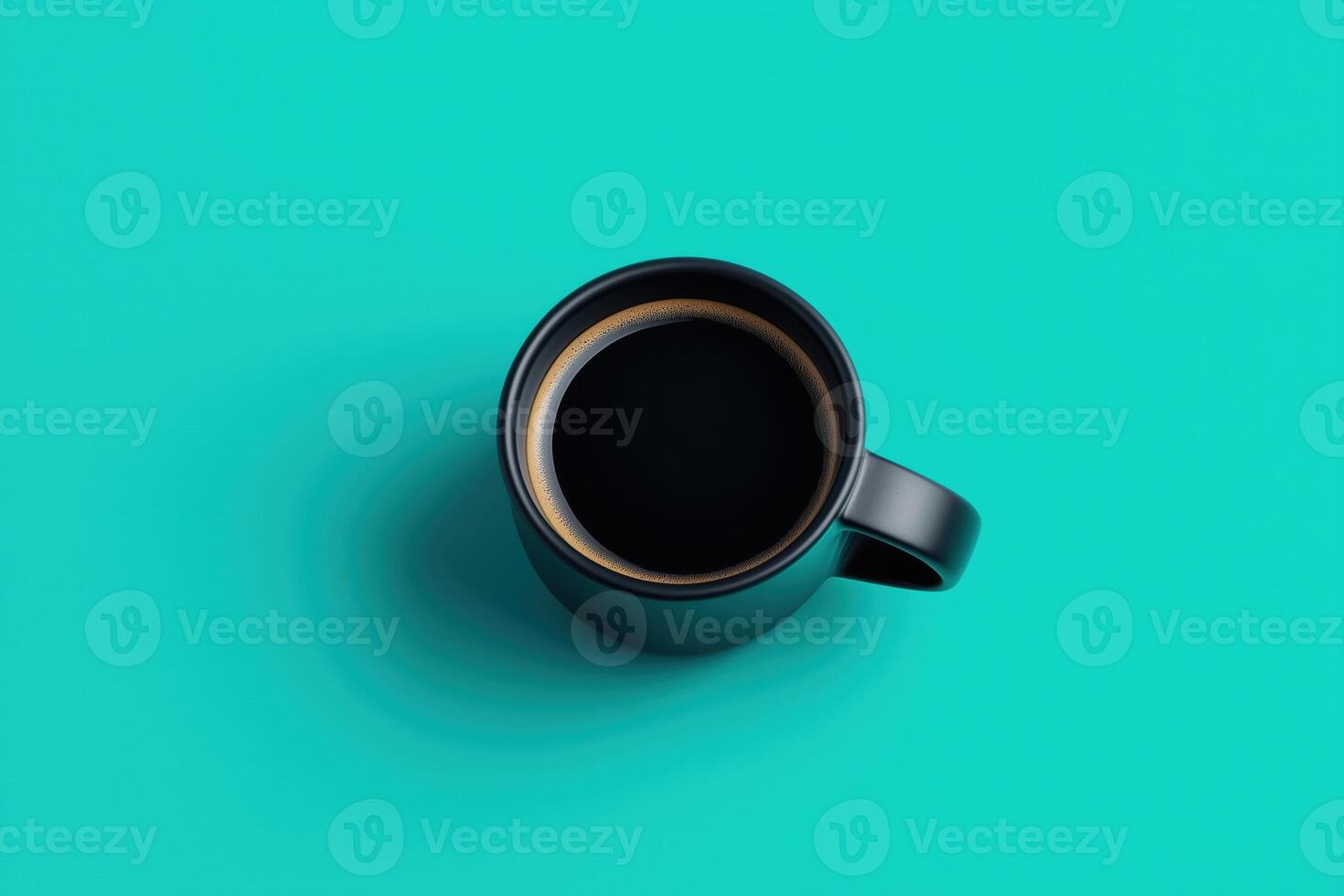 Black coffee in ceramic mug viewed from above on vibrant turquoise background in bold minimal style for morning energy beverage or branding design photo
