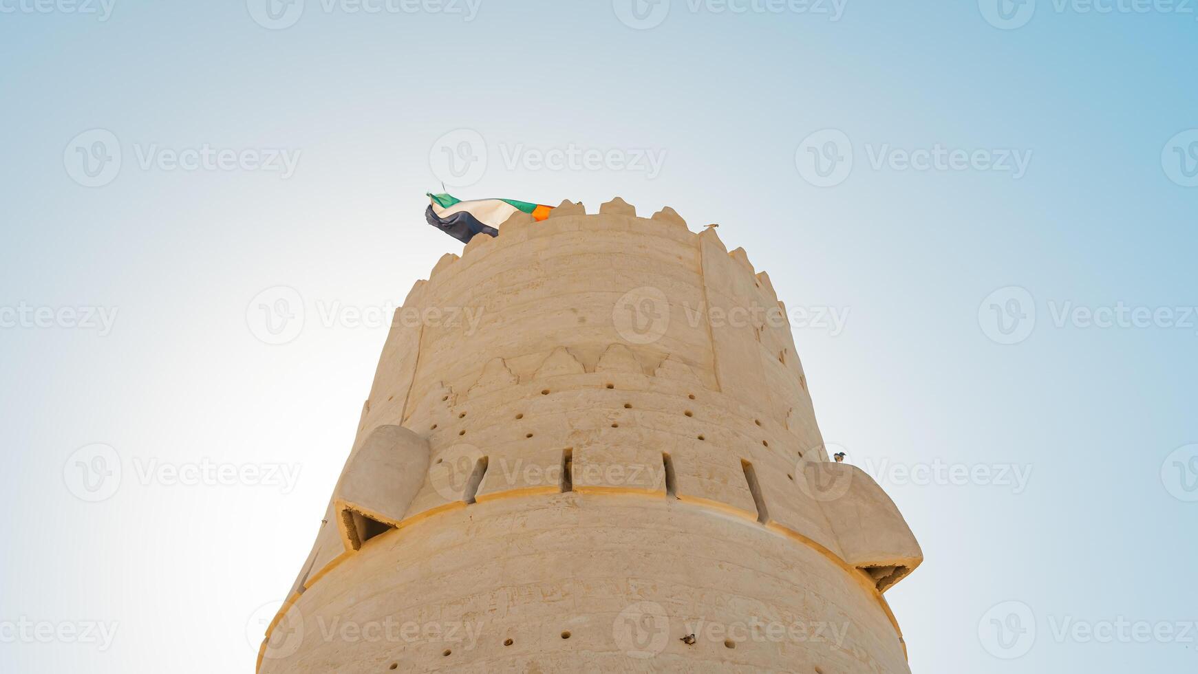 A tall tower with a clock on top photo
