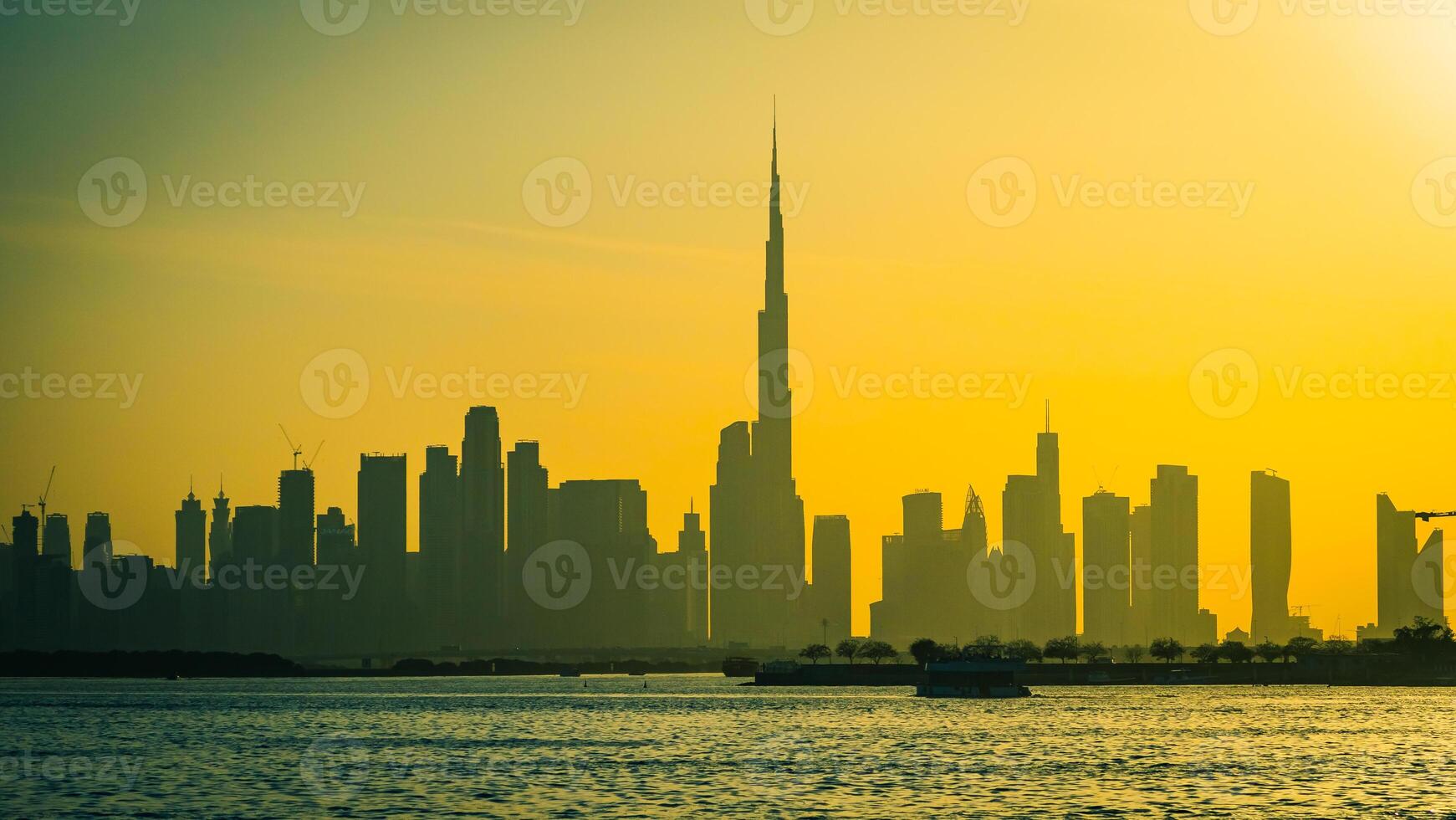 A city skyline with a tall building in the background photo