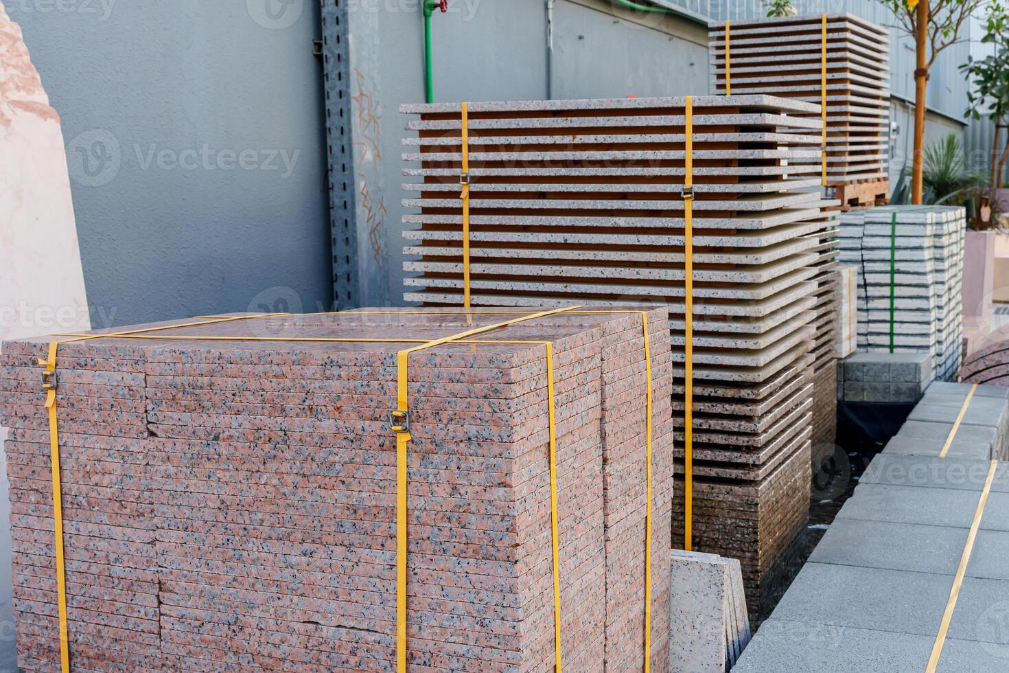 A man standing next to a pile of bricks photo