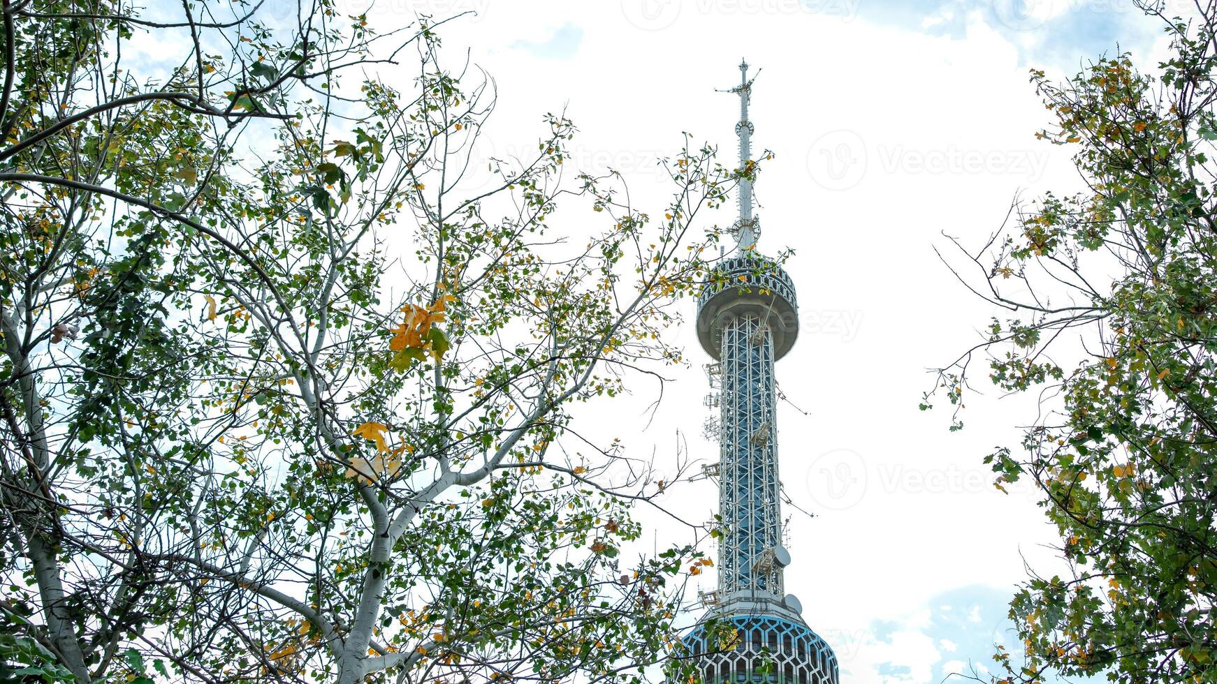 A clock tower with a clock on top of it photo