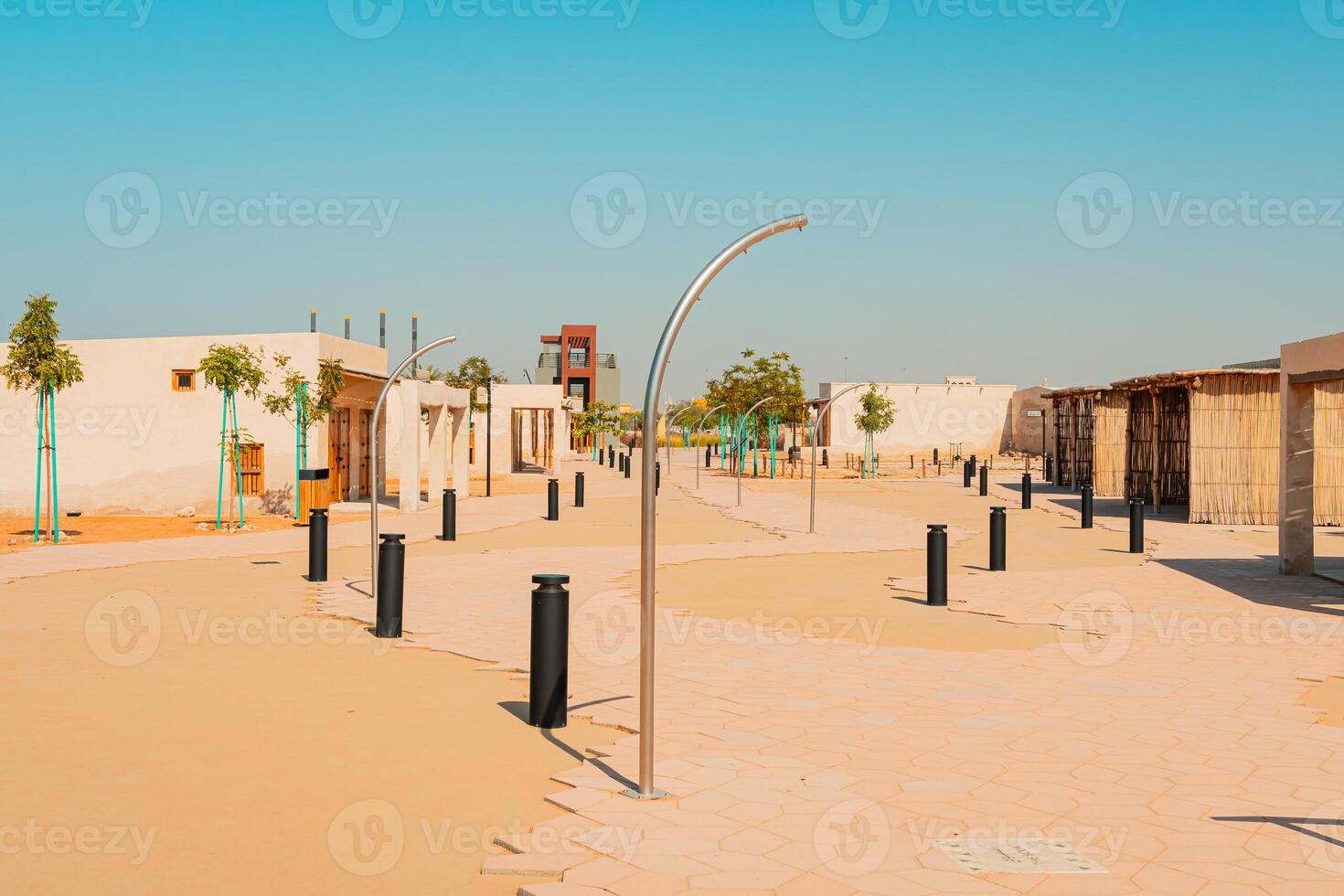 A street with a clock tower in the middle photo