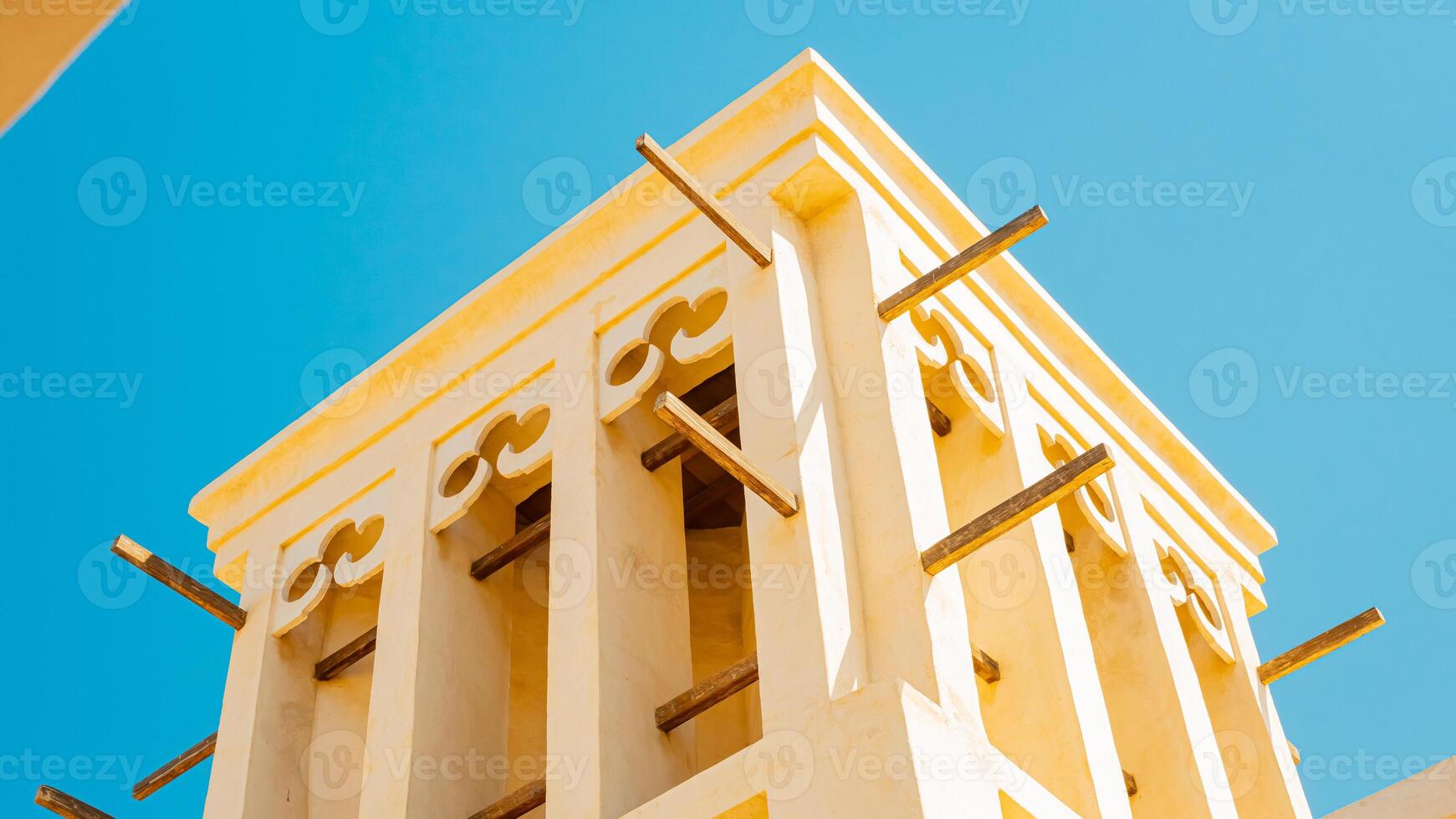 A clock tower with a blue sky in the background photo