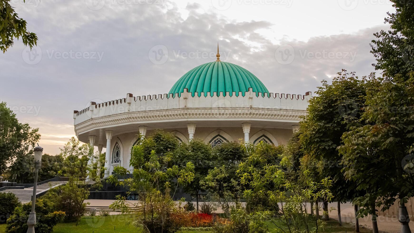The dome of the mosque in the middle of a park photo