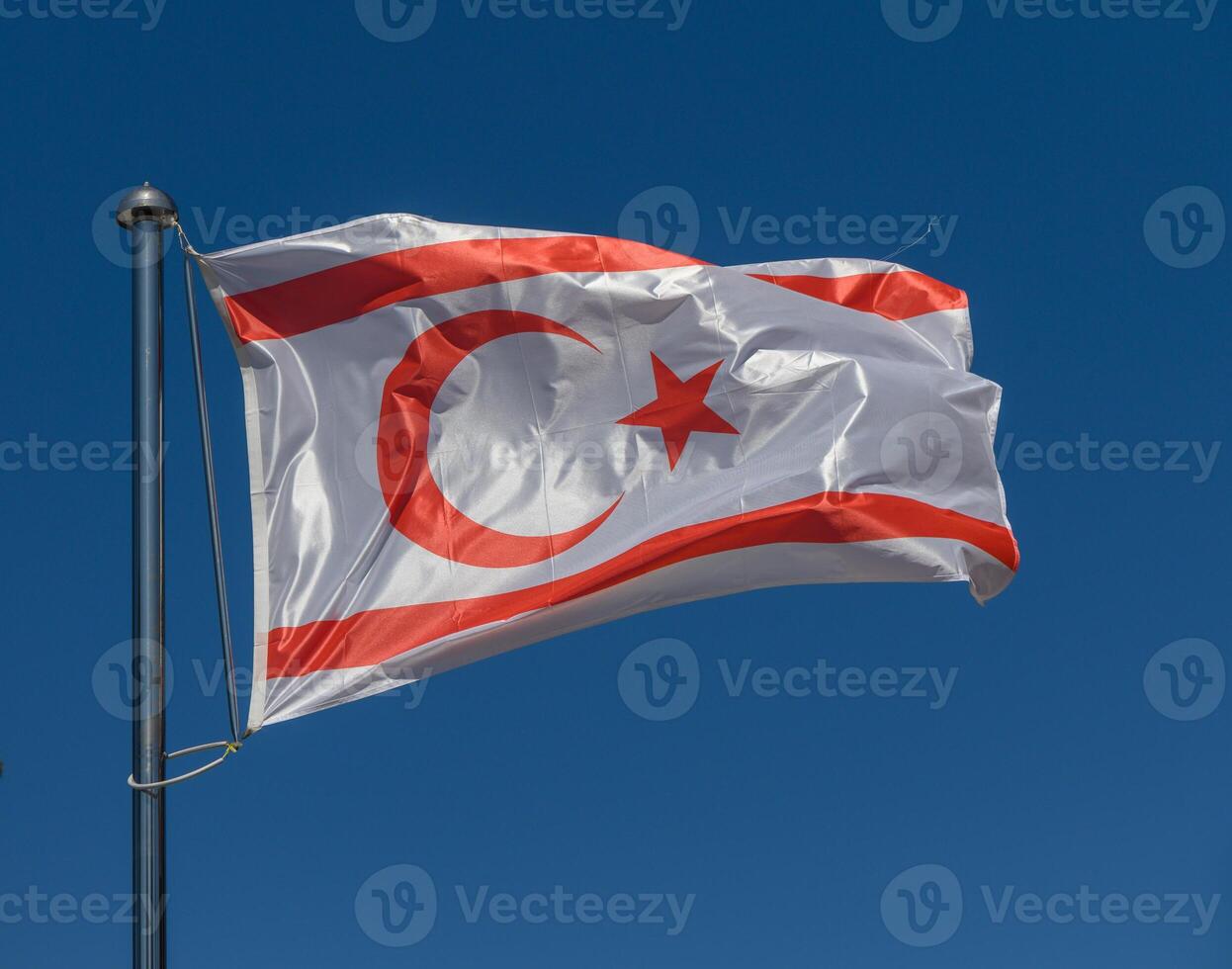 Waving proudly in the sky, the flag of Northern Cyprus featuring a crescent moon and star symbolizes national identity and heritage photo