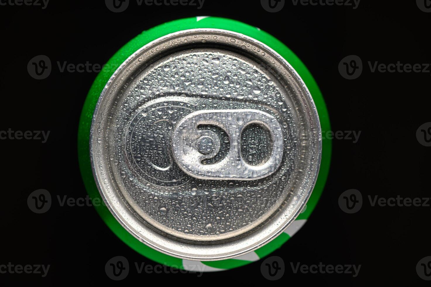 Refreshing beverage can decorated with droplets of water stands out against a dark backdrop, showcasing a moment of cooling summer bliss photo