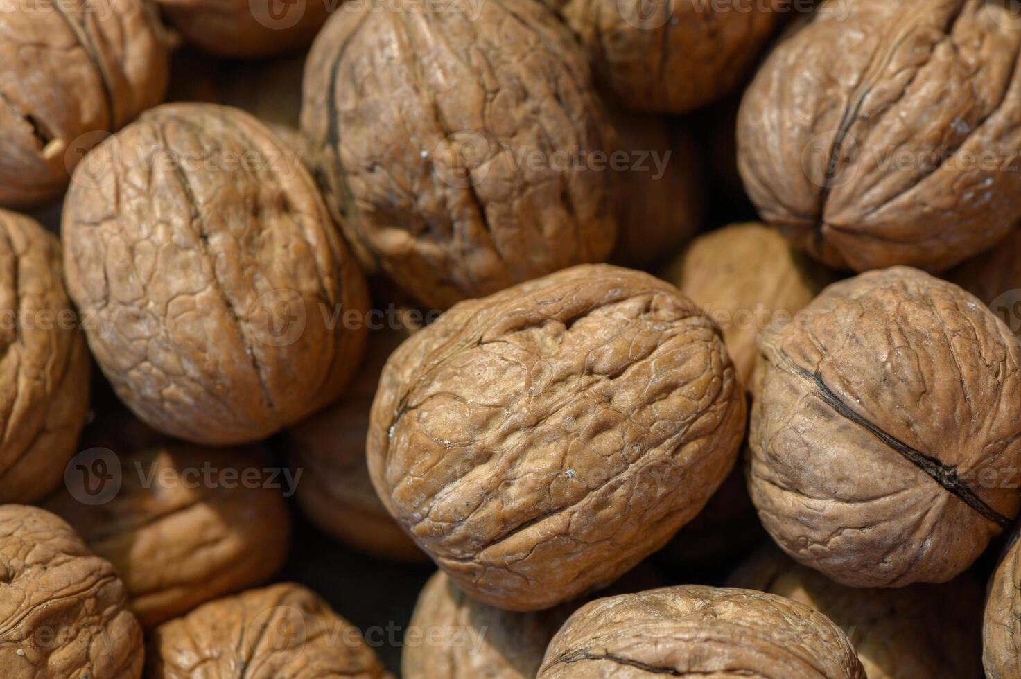 Nuts gathered in a rustic market, showcasing the texture and beauty of these natural treasures photo