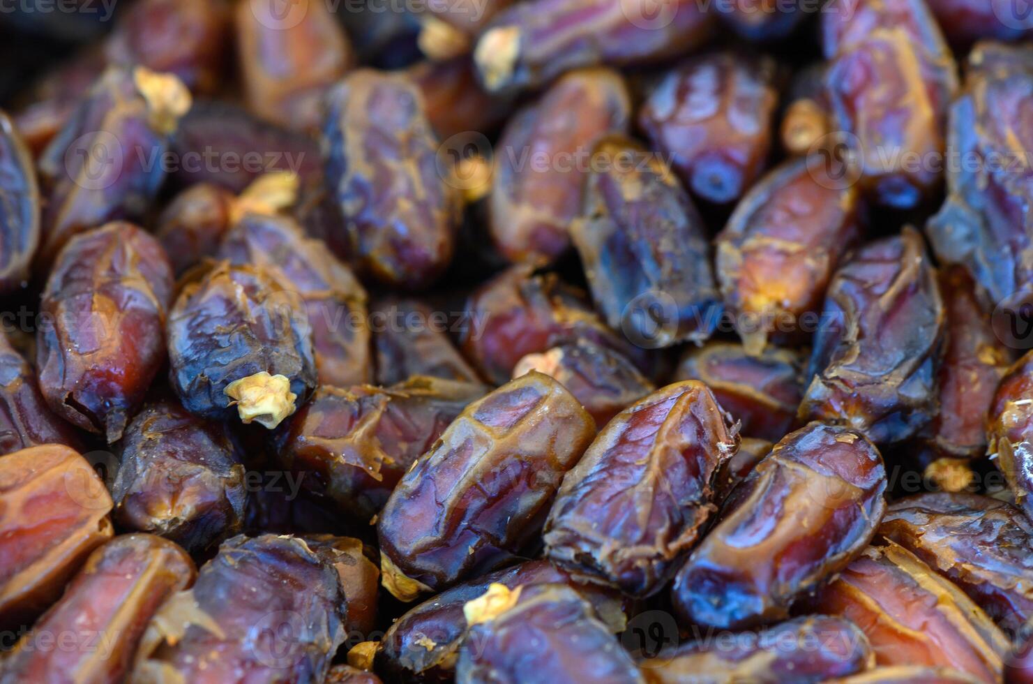 Discovering the rich textures and colors of fresh dates at a vibrant market in the heart of the desert photo